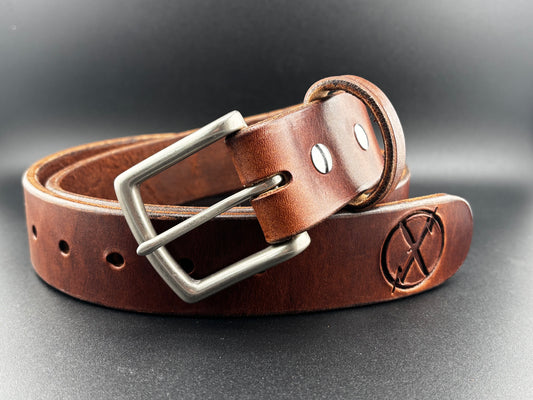 Brown leather belt with silver buckle on a dark background